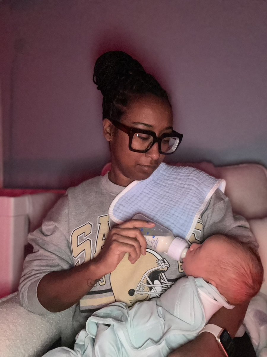 Cymone with a child in her long-term care